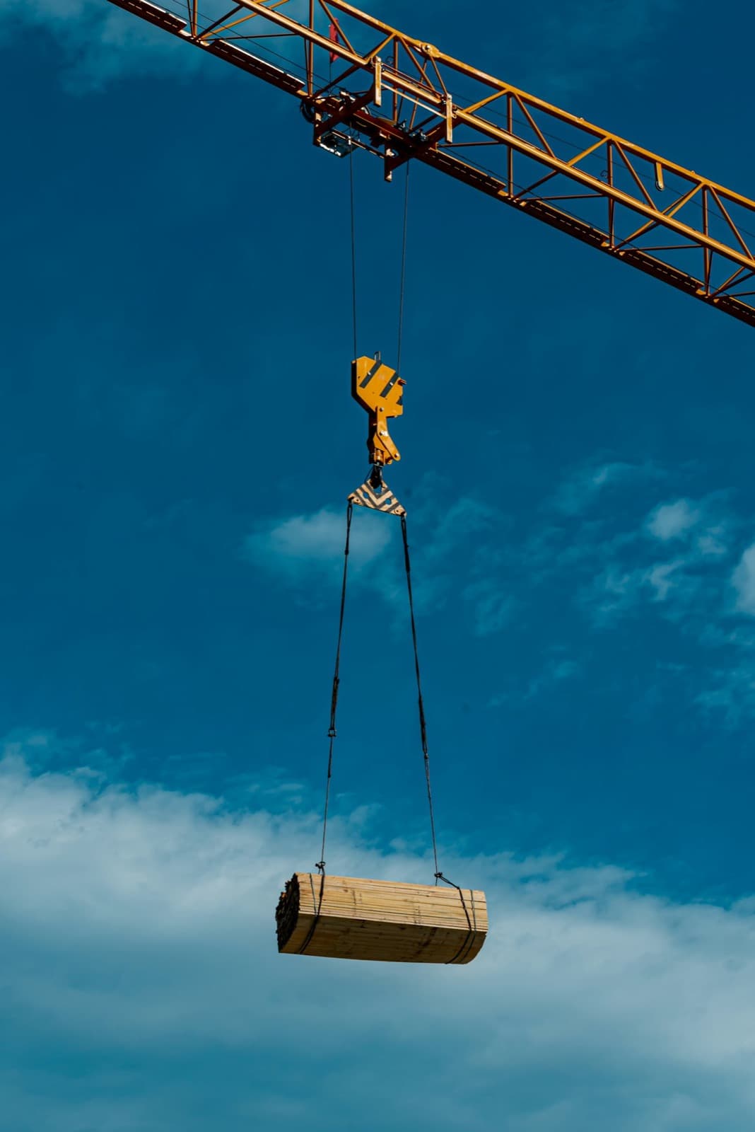 Crane lifting a load against the sky